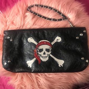 Skull and crossbones fashion clutch